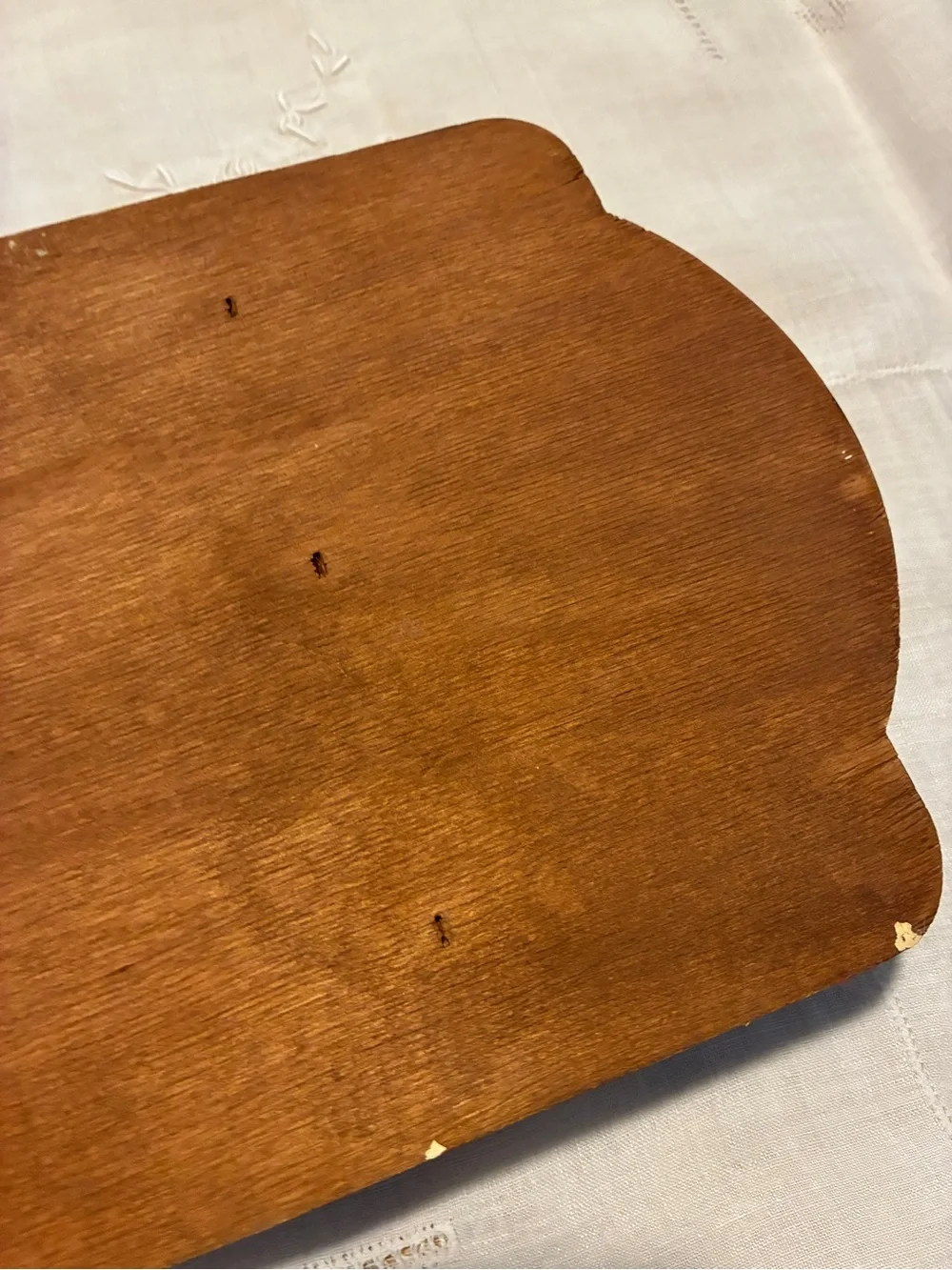 Vintage wood spoon holder with wheat design at the too.